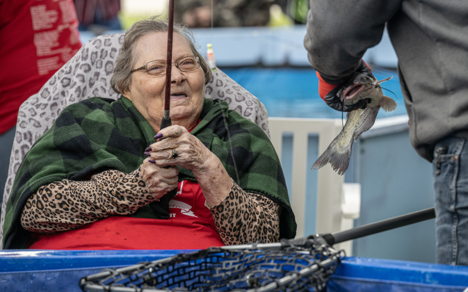 Barbara Lehman keeps watch on one of the catfish  she caught during the 23rd Annual SPJST Senior Living Fishing  Tournament on Thursday, May 7, 2026. Senior Living residents fished for 600 pounds of Channel Catfish during the two-day event which continued on Friday.  Residents and staff were treated to a fish fry to celebrate the event.  The fish were provided by Larry’s Fish Farm in Giddings.   Photo by Andy Sharp.