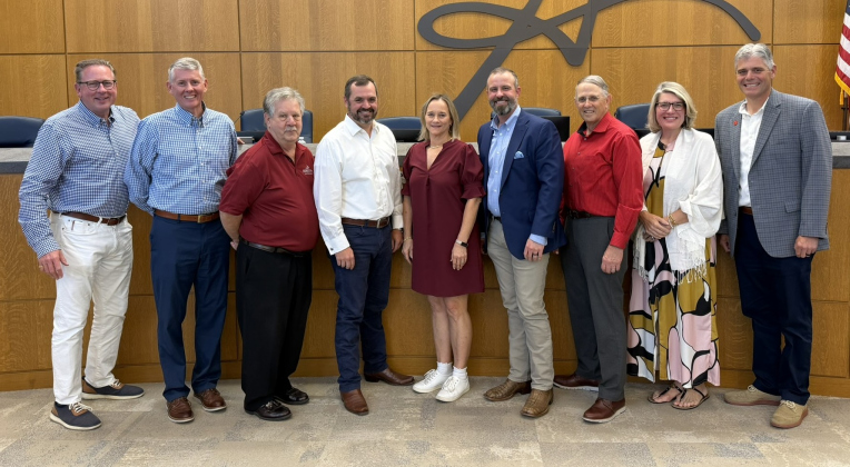 Parks and Recreation Director Kimberly Garrett, center, poses with city council members and City Manager David Morgan and is recognized May 12 for more than 30 years of service to Georgetown. Mr. Garrett also gave a presentation about renovations to parks and trails, during the meeting, marking her final time addressing the council before retirement. Photos courtesy the City of Georgetown