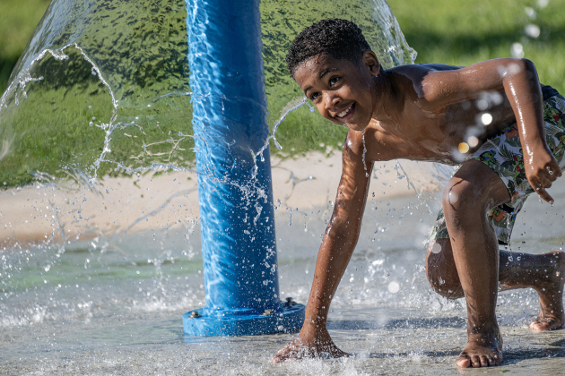 7-year-old Kai Hearns has fun at the San Jose Park splash pad on Wednesday, May 13, 2026.  With temperatures climbing into the 90s this week, families are finding heat relief at area parks and splash pads.     Photo by Andy Sharp.