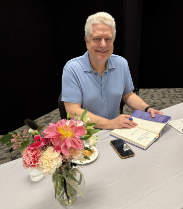 After the Hill Country Author Series presentation, Mark Pryor signs copies of “The Most Mysterious Bookshop in Paris.” Photo by Abbey Archer