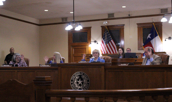 The Williamson County Commissioners Court approves finalizing the purchase of 248 acres for the Jail and Justice Center property. From left, Commissioner Terry Cook of Precinct 1, Commissioner Cynthia Long of Precinct 2, Presiding Judge Commissioner Valerie Covey of Precinct 3, and County Commissioner Russ Boles of Precinct 4. County Judge Steve Snell was absent from the meeting. Photo by Nalani Nuylan.