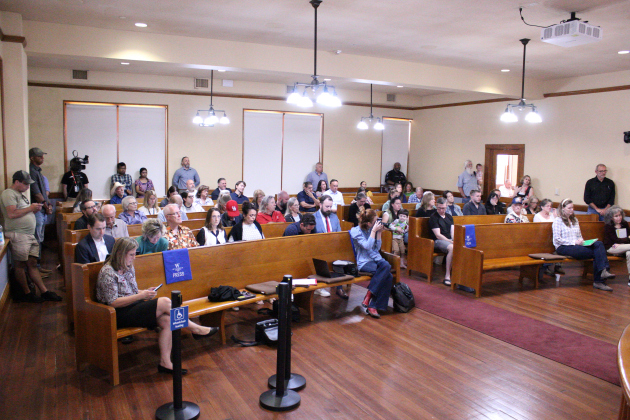 Residents from Carlson Place, Saddle Creek, Pinnacle, Churchill Farms, Summercrest and University Park fill the Commissioner Courtroom during the May 19 meeting. Photo by Nalani Nuylan.