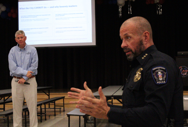 Georgetown Chief of Police Cory Tchida, right, and Ben Stewart, Georgetown City Council District 7, left, answer questions about Williamson County’s Justice Complex in a town hall on Thursday, May 21, at Caver Elementary. Photo by Nalani Nuylan.