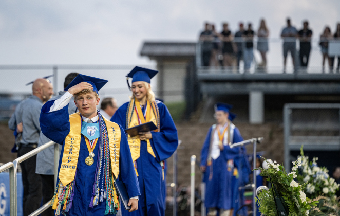 Valedictorian John Papaconstantinou, front, and Salutatorian Emma Cooke, back right, cross the stage for their diplomas  during the 2026 Georgetown High School commencement, held Friday, May 22, 2026 at Birkelbach Stadium.  484 students received their diplomas on this evening.     Photo by Andy Sharp.