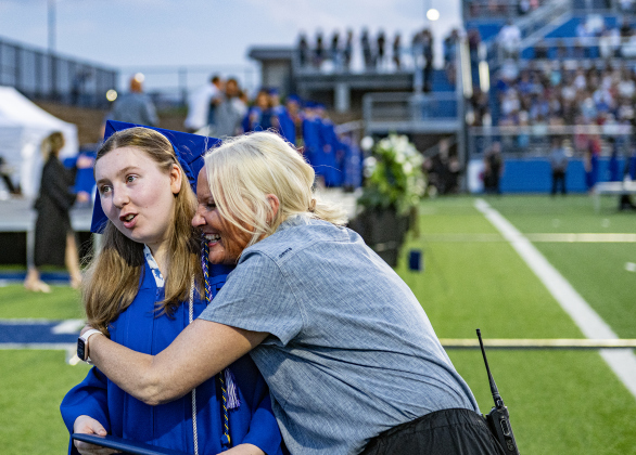 Chloe Reinders is congratulated by Assistant Principal Amy Beran after receiving her diploma during the 2026 Georgetown High School commencement, held Friday, May 22, 2026 at Birkelbach Stadium.  484 students received their diplomas on this evening.     Photo by Andy Sharp.