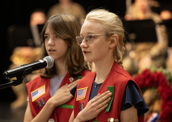 Katherine Cieslak, 12, front, and Raylin Linder, 13, members of Frontier Girls Troop 700, led the audience in the Pledge of Allegiance during the Memorial Day ceremony held in Sun City on Monday, May 25, 2026. Photo by Andy Sharp.