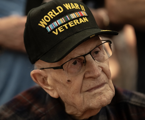 World War II Air Force veteran Ralph May, who will be 99 in two weeks, was an attendee during the Memorial Day ceremony held in Sun City on Monday, May 25, 2026.  The chance of rain moved this year’s ceremony inside the Sun City Social Center ballroom, filled to capacity with several hundred attendees.    Photo by Andy Sharp.