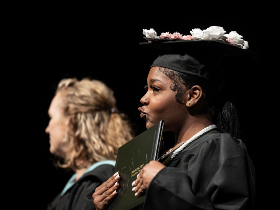 Richarte graduate Akeelah Sanaa Smith embraces her diploma  during the Richarte High  Class of 2026 Commencement held at the Rodney and  Mary Klett Performing Art Center on Thursday, May 21, 2026.