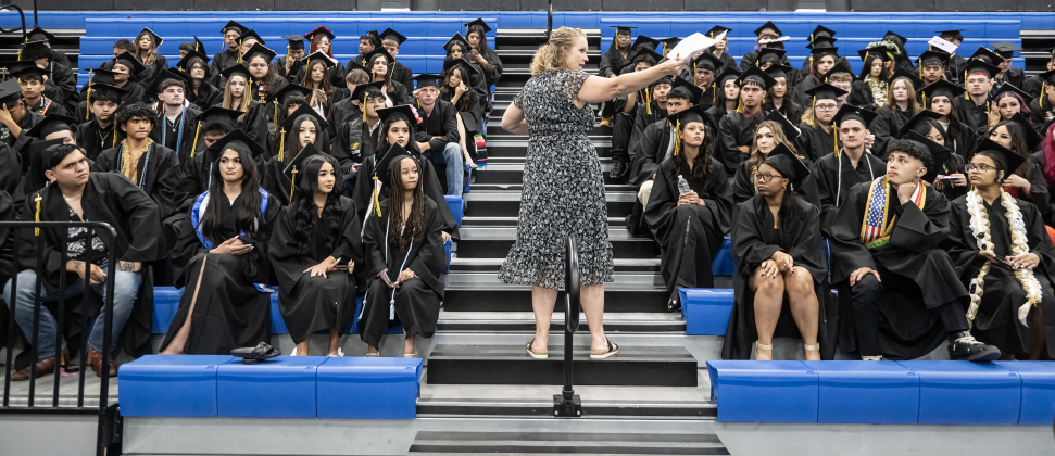 Richarte counselor Christina Hollander gives directions to graduates before they enter the auditorium  for Richarte High  Class of 2026 Commencement held at the Rodney and Mary Klett Performing Art Center on Thursday, May 21, 2026.  This year Richarte had 128 graduates, with 108 of them scheduled to walk the stage for their degrees.     Photo by Andy Sharp.