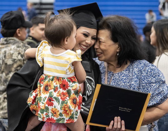 Richarte High graduate Mariah Rose Soto, holding her daughter Leanna, 2, gets a hug from her grandmother Sandra Soto, right, at the completion of Richarte’s Class of 2026 Commencement held at the Rodney and Mary Klett Performing Art Center on Thursday, May 21, 2026.