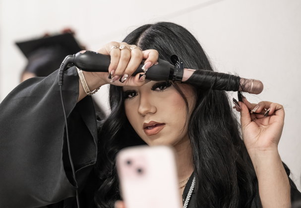 Richarte High graduate Isabella Sanchez fixes her hair before joining other graduates receiving their diplomas  during Class of 2026 Commencement held at the Rodney and Mary Klett Performing Art Center on Thursday, May 21, 2026.