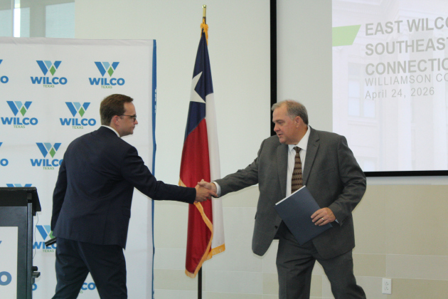 Precinct 4 County Commissioner Russ Boles (right) welcomes Ronald Kurtz, U.S. Department of Housing and Urban Development (HUD) Assistant Secretary for Community Planning and Development, to Wilco, April 24. Photo by Nalani Nuylan.