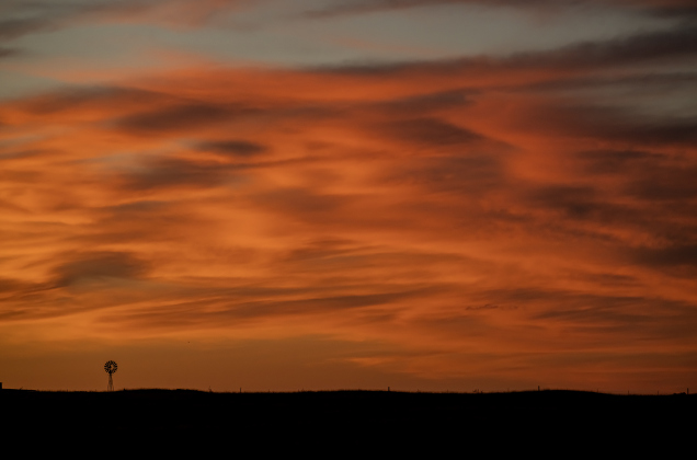 The skies fill with vibrant color a few minutes past sunset  in this view from County Road 420 in Thrall on Wednesday, May 27, 2026.  Photo by Andy Sharp.