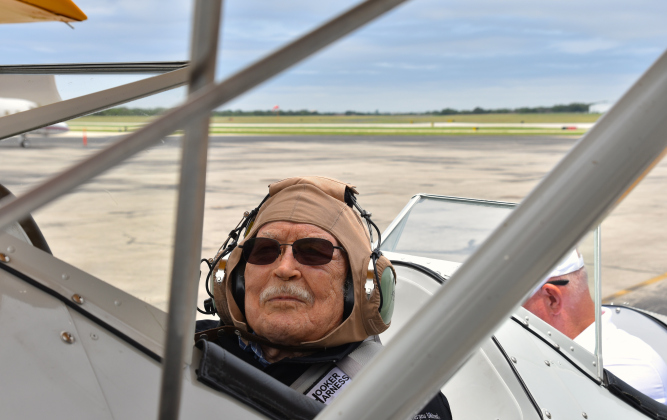 Grover Trytten, a 104-year-old WWII veteran who flew nighttime missions including Battle of the Bulge, smiles before takeoff during Dream Flights on May 6.
