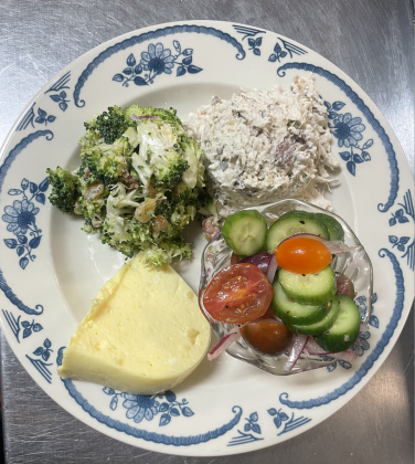 Emily’s Sampler Plate at Laurie’s Cafe with chicken salad, broccoli salad, congealed salad, and the cucumber and tomato vinaigrette salad. Photo Courtesy of Jacob Ernest