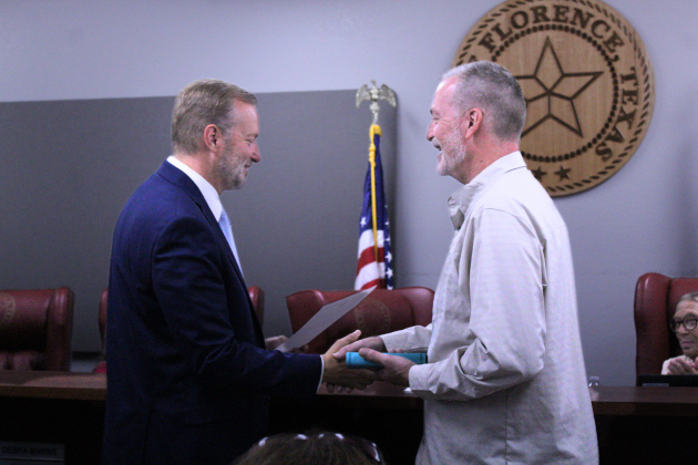 Ben Daniel, right, is sworn in by County Judge Steve Snell, left, as the Mayor for the City of Florence for his second and final term during the June 2 City Council meeting. Photo by Nalani Nuylan.