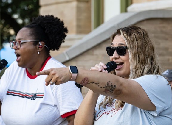 Sala Funderburgh, left, and Ashley Wooley, right, singers with  Vinyl Countdown G/ATX!  Perform during the free First Friday concert held on the Williamson County Courthouse lawn on Friday, June 12, 2026.  The concerts, hosted by the Georgetown Beard Club, are generally on the first Friday of the month, but this one was postponed because of rain last week.     Photo by Andy Sharp