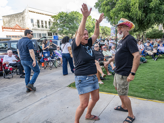 Andrea Price and her husband Michael Price, members of the Georgetown Beard Club, dance to the music played by  Vinyl Countdown G/ATX! during the free First Friday concert held on the Williamson County Courthouse lawn on Friday, June 12, 2026.  The concerts, hosted by the Georgetown Beard Club, are generally on the first Friday of the month, but this one was postponed because of rain last week.     Photo by Andy Sharp