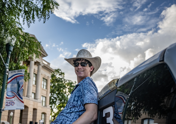 Witten Barnes relaxes in the back of a truck along Main Street as music is played by  Vinyl Countdown G/ATX! during the free First Friday concert held on the Williamson County Courthouse lawn on Friday, June 12, 2026.  The concerts, hosted by the Georgetown Beard Club, are generally on the first Friday of the month, but this one was postponed because of rain last week.     Photo by Andy Sharp