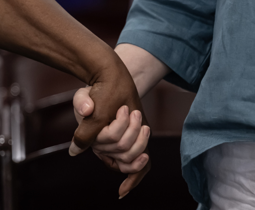 Attendees clasped hands as “Reach Out and Touch” was played during the closing presentation at the 74th Annual Juneteenth  Celebration held at the Georgetown Community Center on Saturday, June 13, 2026.  The event is hosted by the Georgetown Cultural Citizen Memorial Association.    Photo by Andy Sharp.