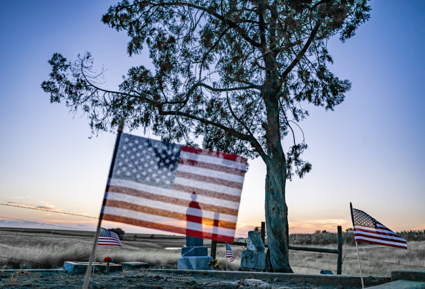 American flags adorn burial sites at Mager Cemetery on Saturday, June 13, 2026.  They were placed this weekend by volunteers from the Hermann Sons Coupland-New Bern Lodge.  The flags coincide  with Flag Day on Sunday, June 14, 2026.   Photo by Andy Sharp. 
