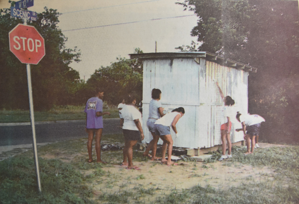 Juneteenth contestants in 2003 use grant funds to refurbish and paint two bus shelters — one in Grasshopper and one in Track — to protect students waiting for school buses. Sun Archive
