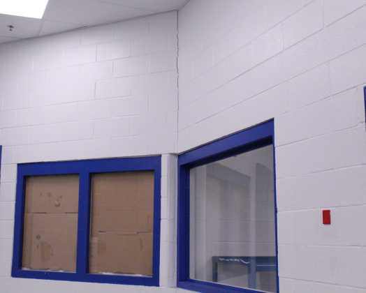 In one of the female inmate pods of the jail, a crack forms along on of the walls. Photo by Nalani Nuylan..