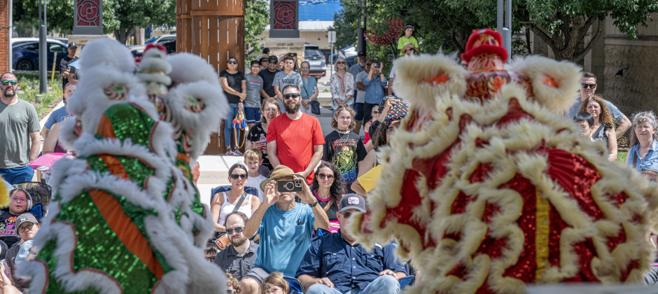Members of the Summit Dragon &amp; Lion Dance Team perform for an audience  in the Light and Waterworks District area on Saturday,  May 30, 2026.  The free program was offered by the Georgetown Public Library.   Photo by Andy Sharp.