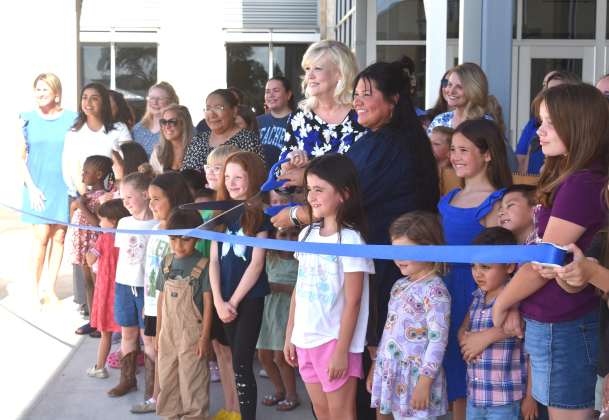 Future Berry Creek students, staff, and JISD trustees get ready to cut the ribbon in the school’s opening ceremony. Center are principal Lara Hutchinson, left, and JISD Board President Jenny Arnold. Photos by Katherine Hamilton