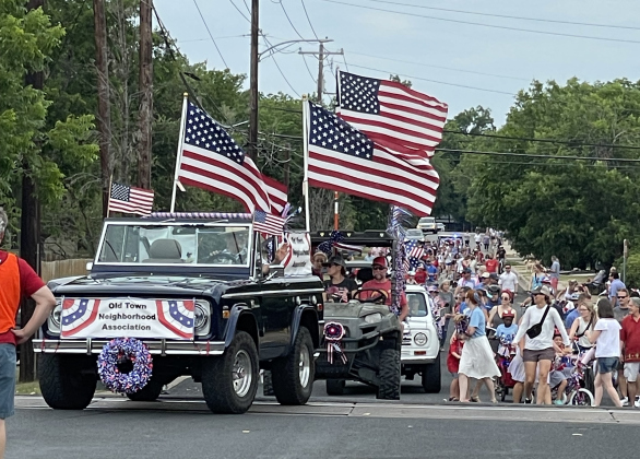 The Old Town July 4 parade travels trough the neighborhood as residents walk to San José Park in Georgetown in 2023. (Sun Archive)