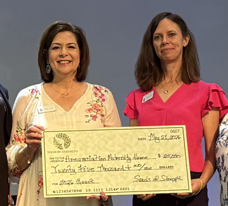 Accepting a grant, from left, are Annunciation Maternity Home Executive Director Cynthia Flores and Allison McKee, director of donor interests.