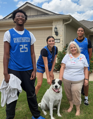 Among the young athletes' many ways of helping Sun City residents were washing dogs and windows, planting flowers, weeding flower beds and pruning shrubs. The teams' service initiative is called "Helping Hands."