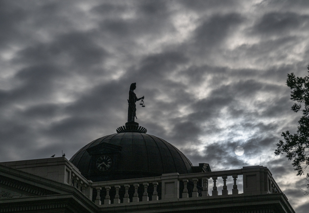 The sun manages to peak through a thick layer of morning clouds over the Williamson County Courthouse, as seen from Austin Avenue during Market Days on Saturday, July 11, 2026.  Market Days  is held on the second Saturday  of the month in downtown Georgetown.   Photo by Andy Sharp