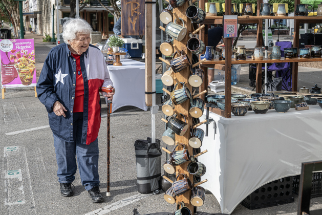 Von Brookshire, 95, enjoys looking at items for sale along Main Street during Market Days on Saturday, July 11, 2026.  Market Days  is held on the second Saturday  of the month in downtown Georgetown.   Photo by Andy Sharp