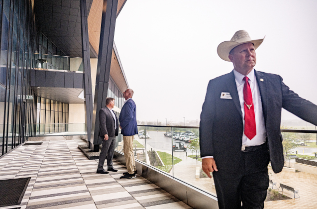 Sheriff Matthew Lindemann looks outside from a covered balcony adjacent to the Commissioners Courtroom during the Grand Opening event for the  Williamson County Administration Building  on Tuesday, July 14, 2026.  A ribbon-cutting ceremony was held in the Commissioners Courtroom.   Photo by Andy Sharp