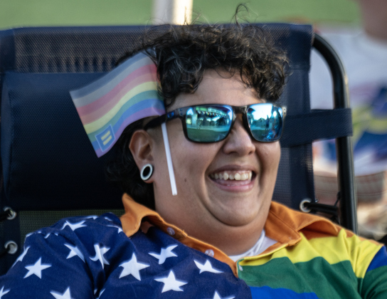 Miranda Salazar enjoyed a performance by the Wild Heaven Band during  the 6th Annual Taylor Pride Festival, held at Heritage Square Park on Saturday evening, June 27, 2026.     Photo by Andy Sharp