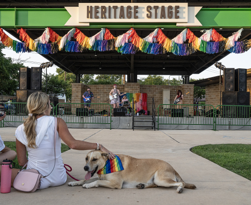 Taz and his owner Lindsey Smith enjoyed listening to a performance by the Wild Heaven Band during  the 6th Annual Taylor Pride Festival, held at Heritage Square Park on Saturday evening, June 27, 2026.     Photo by Andy Sharp