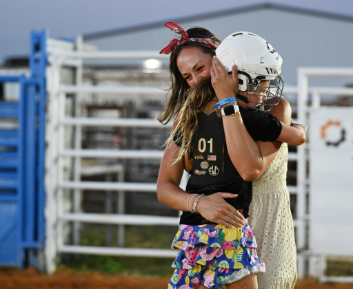 6-year-old Maya Thurston, who won first place in Mutton Bustin’ is congratulated by her mom Taylor Thurston at the 82nd Annual Williamson County Sheriff’s Posse Rodeo on Friday, June 26, 2026. The rodeo continued through Saturday night.    Photo by Andy Sharp