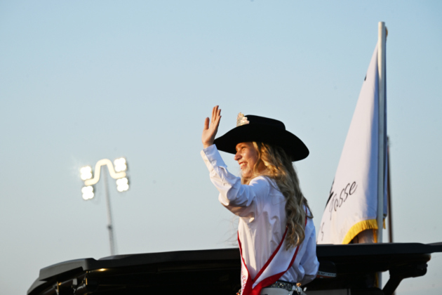 Aleena Isham, 17, this year’s Rodeo Sweetheart, offers a wave to attendees during  the 82nd Annual Williamson County Sheriff’s Posse Rodeo on Friday, June 26, 2026. The rodeo continued through Saturday night.    Photo by Andy Sharp