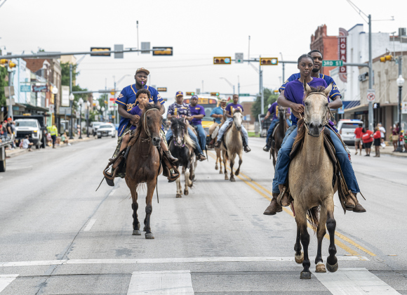 Members of 290 Boyz ride their horses along Main Street as they participate in Taylor’s Juneteenth celebration on Saturday, June 20, 2026.    Photo by Andy Sharp