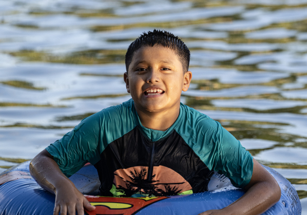 9-year-old Hank Rodriguez enjoyed the cool waters of the San Gabriel River near San Gabriel Park on Monday, June 22, 2026, the first day of summer.  Temperatures reached into the mid-upper 90s on this day.    Photo by Andy Sharp