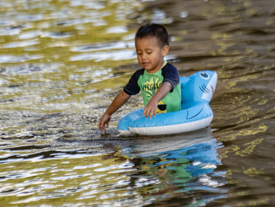3-year-old Fran Rodriguez enjoyed the cool waters of the San Gabriel River near San Gabriel Park on Monday, June 22, 2026, the first day of summer.  Temperatures reached into the mid-upper 90s on this day.    Photo by Andy Sharp