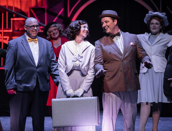 Antonette Knoedl, left, with suitcase, as Peggy Sawyer, and Dana McLaughlin, playing  Billy Lawlor, are shown in a photo from the dress rehearsal of the Georgetown Palace production of “42nd Street”  on Thursday, July 23, 2026. The show runs through August 30 on the Springer Stage.   Photo by Andy Sharp
