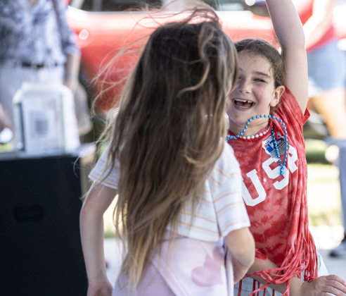 8-year-old Juniper Simmel, facing camera at right, dances with her friend Nadia Golden, 7, as they enjoy  music performed by a group called Best of the Band during the Sertoma Club 4th of July celebration  in San Gabriel Park on Saturday, July 4, 2026.   Photo by Andy Sharp