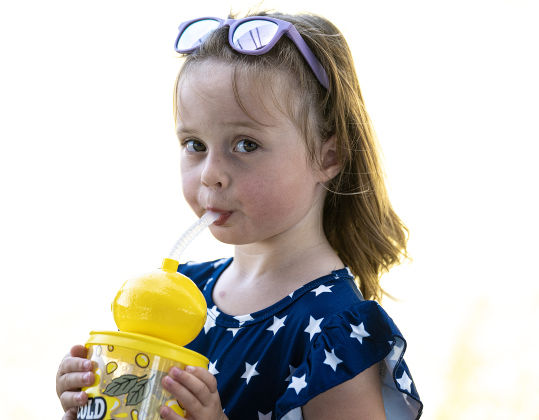 3-year-old Isla Loethen cools off with an icy lemonade during the Sertoma Club 4th of July celebration in San Gabriel Park  on Saturday, July 4, 2026.   Photo by Andy Sharp