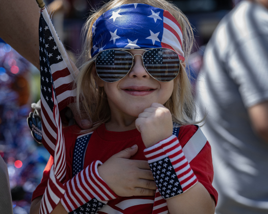 4-year-old Waylon Goebel, saluting during the posting of the colors, was one of the colorfully attired participants in the Sertoma Club’s Hometown Parade through San Gabriel Park during the Sertoma Club 4th of July celebration on Saturday, July 4, 2026.   Photo by Andy Sharp