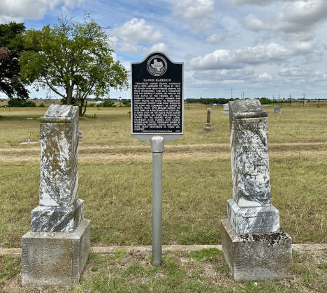 A historic marker in Corn Hill Cemetery tells the story of Daniel Harrison.   Photo by Joe Plunkett