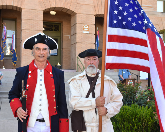 Mark Chester, left, and Keith Pearce, from the Sons of the American Revolution Alexander Hamilton Georgetown Chapter, were dressed in 18th century period clothing on July 8. They presented the colors before a reading of the Declaration of Independence on the Square. (Photos by Kaitlyn Wilkes)