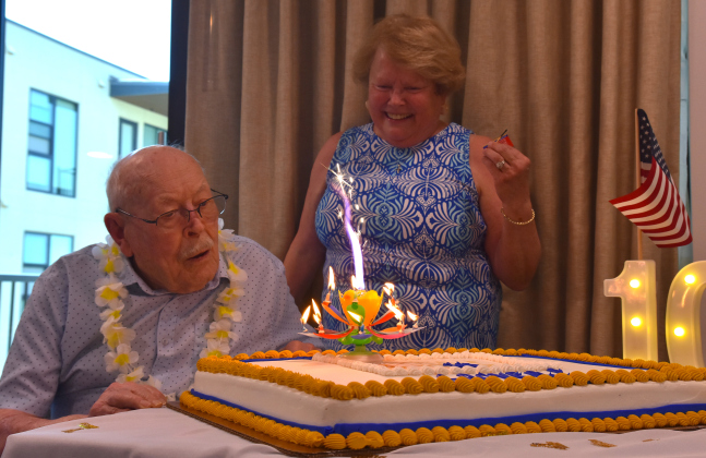 Grover Trytten, left, blows out his birthday candles with his daughter, Lynn Trytten Owens looking on. The 105th birthday party for Mr. Trytten took place on July 22 at Touchmark at Georgetown. (Photos by Kaitlyn Wilkes)