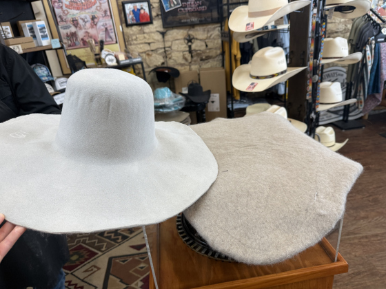 Mr. Funmaker explained felting is a process of compressing beaver and/or rabbit fur into felt. He changes the contours of the hat through shaping the hat through various steaming processes.